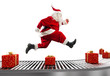 © alphaspirit - Santa Claus runs on the conveyor belt to arrange deliveries at Christmas time
