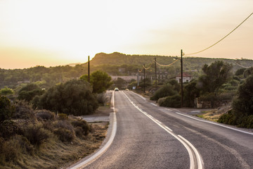 dry highway car road on mountain horizon background in evening time before sunset