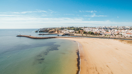 Aerial view of beautiful Meia Praia beach in Lagos, Algarve, Portugal at morning