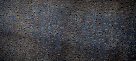 The texture of the metal with welded decoration