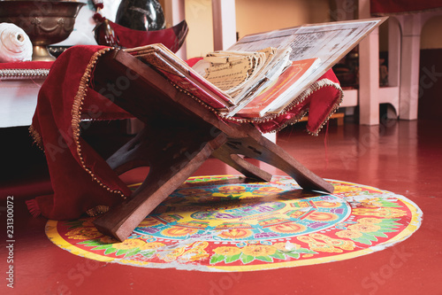 Holy Book At A Hindu Alter With The Words Happy Diwali Written
