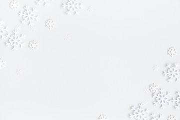 Christmas composition. Christmas frame made of snowflakes on pastel gray background. Winter concept. Flat lay, top view, copy space