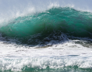 big breaking wave at hanakapiai beach, kauai, hawaii.