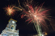 Colorful firework celebration..Fireworks displaying up in the sky over clock tower circle landmark of phuket town ..