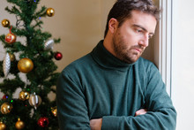Sad Man Feeling Negative Emotions And Alone During Christmas