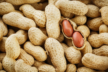 Peeled peanut on well peanuts. Peanuts, for background or textures.