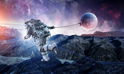 Wall Mural - Spaceman steal planet. Mixed media