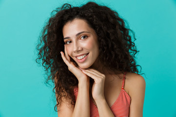 Sticker - Image of cute woman 20s wearing casual clothing smiling, standing isolated over blue background