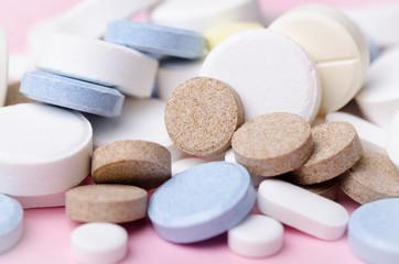 pills and tablets close-up, soft focus