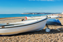Fishing Boats In Seaford Beach, East Sussex. England, Pebbly Beach And Blue Sea, View Of Newhaven Town, Selective Focus