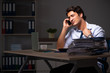 © Elnur - Young financial manager working late at night in office