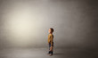 © ra2 studio - Little waggish kid staying alone in a big empty room with his plush
