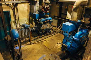 Sticker - Old industrial electric compressors in cellar under factory