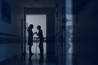 © Yakobchuk Olena - Woman and physician are standing in hospital corridor. Patient is walking with stick while female practitioner is holding her hand. Copy space in right side