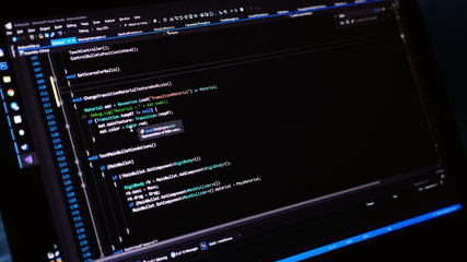 The code of the website on the computer monitor. The programmer at work.