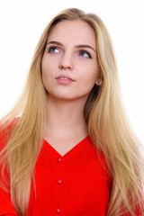 Wall Mural - Face of young beautiful teenage girl thinking while looking up