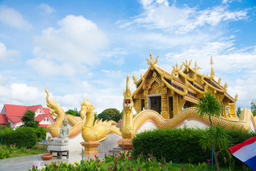 Beautiful thai temple with blue sky background.