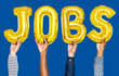 © Rawpixel.com - Hands showing jobs balloons word