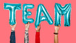 © Rawpixel.com - Hands showing team balloons word