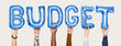 © Rawpixel.com - Hands holding budget word in balloon letters