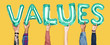 © Rawpixel.com - Hands holding values word in balloon letters