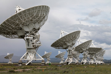 The Very Large Array (VLA) radio-astronomy antennas, in New Mexico, is one of the most impressive observatories in the world. The Sun was piercing through after a major storm during a public tour. 