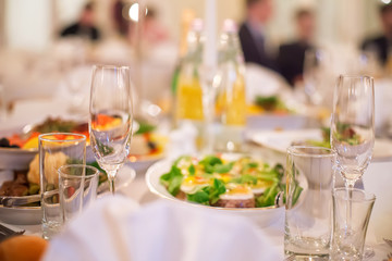 Catering banquet table with business people silhouette at background