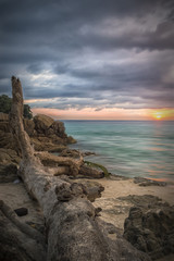 Wall Mural - Amazing sunset seen from a beautiful beach in Phuket, Thailand.