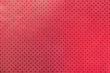 Red background from metal foil paper with a stars pattern