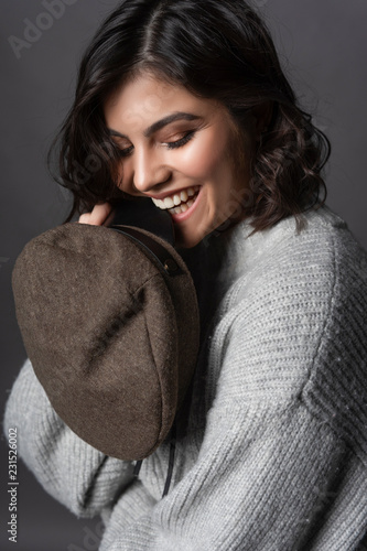 Beautiful Smiling Brunette Girl Wearing A Casual Style Knitted