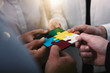 © alphaspirit - Teamwork of partners. Concept of integration and startup with puzzle pieces