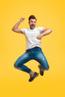 © kegfire - Playful jumping man on yellow background