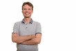 © Ranta Images - Happy Caucasian man looking confident with arms crossed