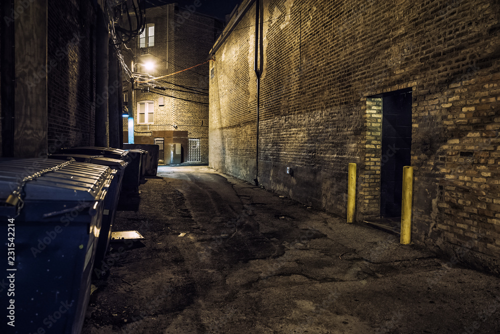 Dark and scary downtown urban city street corner alley with an eerie ...