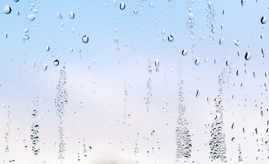 Wall Mural - water drops on glass, rain drops on window glass afther the rain