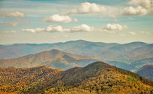 The Fantastic View From Brasstown Bald Mountain ( The Highest Mountain In Georgia) Colorful In Fall Season With White Fluffy Clouds And Blue Sky, North Georgia In USA.