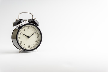 Clock isolated on white background with selective focus and crop fragment