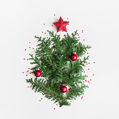 chrristmas tree made of coniferous tree branches on pastel gray background. christmas, winter, new y