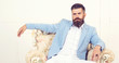 © Roman - Fashion posing adult man in fashion suit. Perfect to last detail. Close-up of suit. Business men. Sewing. Fashionable suit.