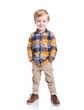 Cute little boy posing with the hands in his pockets, isolated over white background