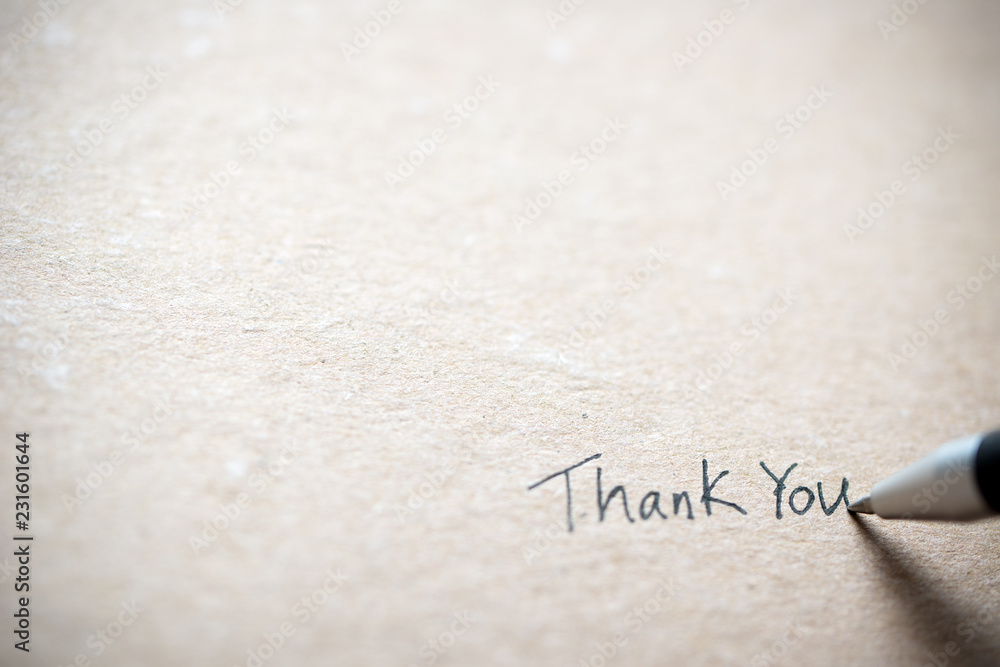 Hand writing thank you on piece of old grunge paper - obrazy, fototapety, plakaty 
