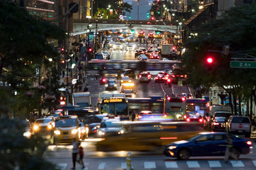 42nd Street is crowded with the busy night lights of crosstown traffic through Midtown Manhattan in New York City