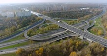 Aerial: Global Car Influence On An Environment. Cars Running On A Highway