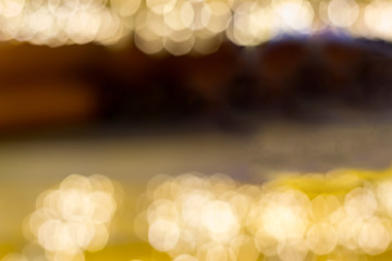 Wall Mural - abstract background of blurred light gold bokeh