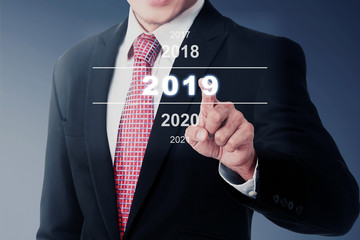 Sticker - Businessman select 2019 number on digital screen