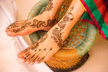 Wall Mural - henna being applied to leg, indian wedding.