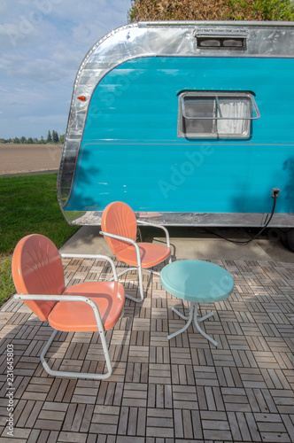 Blue Trailer And Orange Metal Chairs Buy This Stock Photo And