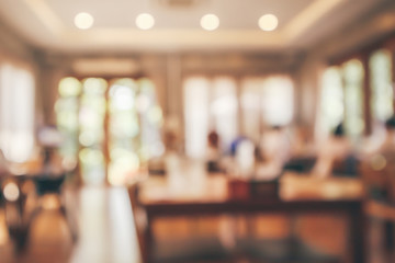 Wall Mural - Restaurant interior with customer and wood table blur abstract background with bokeh light