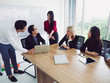© potsawat - business people in meeting room,Business team explaining new business ideas