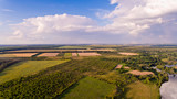 Fototapeta Do pokoju - Aerial view of fields, forest, river, a beautiful landscape of nature.